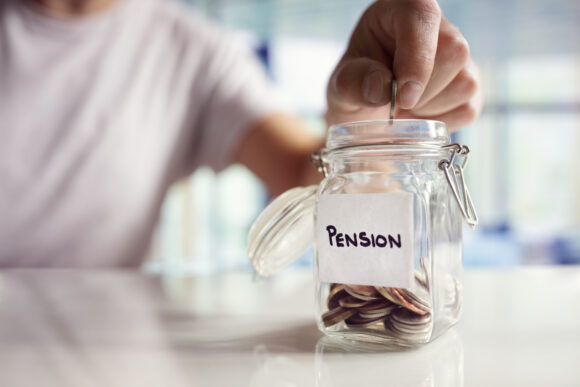 Person adding coins to a jar titled "pension".
