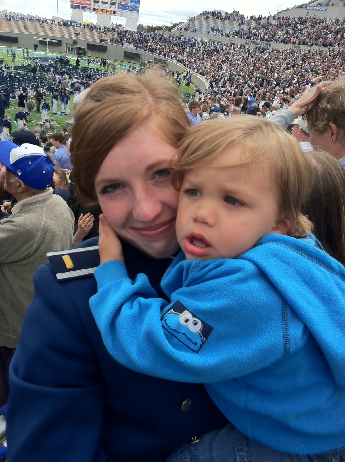 military mother holds child