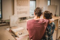 Military couple looking at home renovations that are in progress